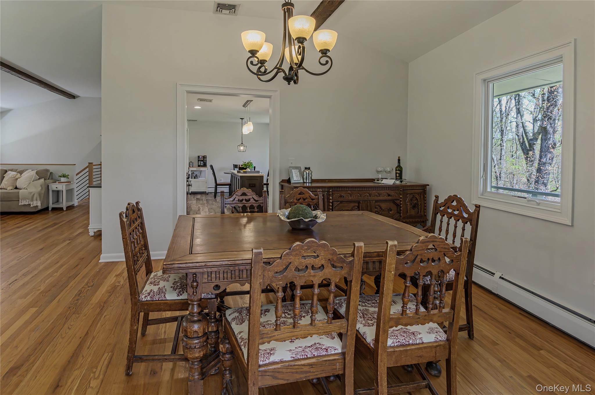 41 Cross Pond Road Pound Ridge, NY 10576 - Photo 17 of 41 a view of a dining room with furniture wooden floor and a chandelier