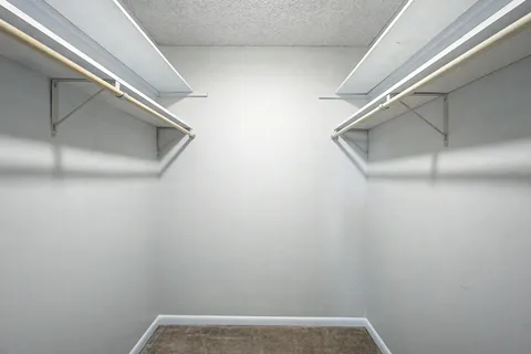 a bathroom with a shower sink vanity and mirror