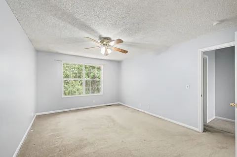 a view of a livingroom with a chandelier fan