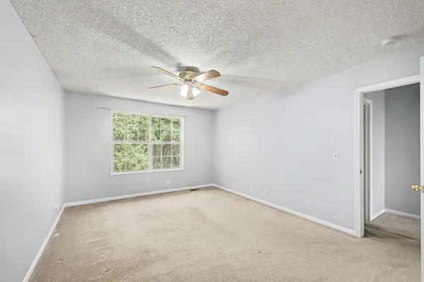 a view of a livingroom with a chandelier fan