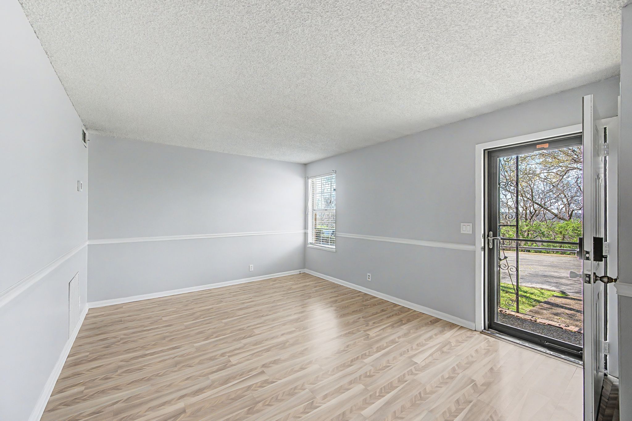 110 Bellevue Road, Unit 30 Nashville, TN 37221 - Photo 3 of 43 an empty room with wooden floor and windows