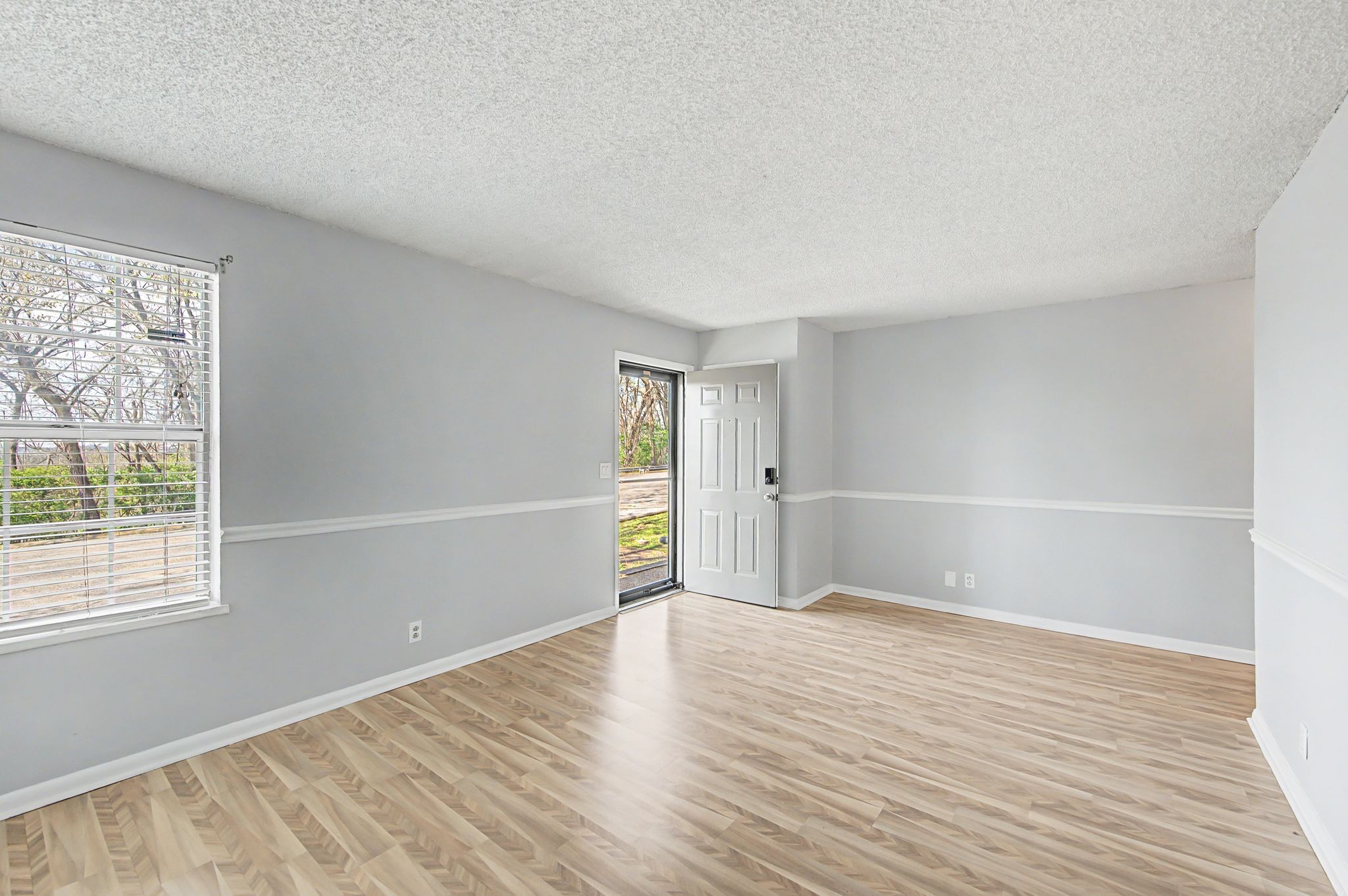 110 Bellevue Road, Unit 30 Nashville, TN 37221 - Photo 4 of 43 an empty room with wooden floor and windows
