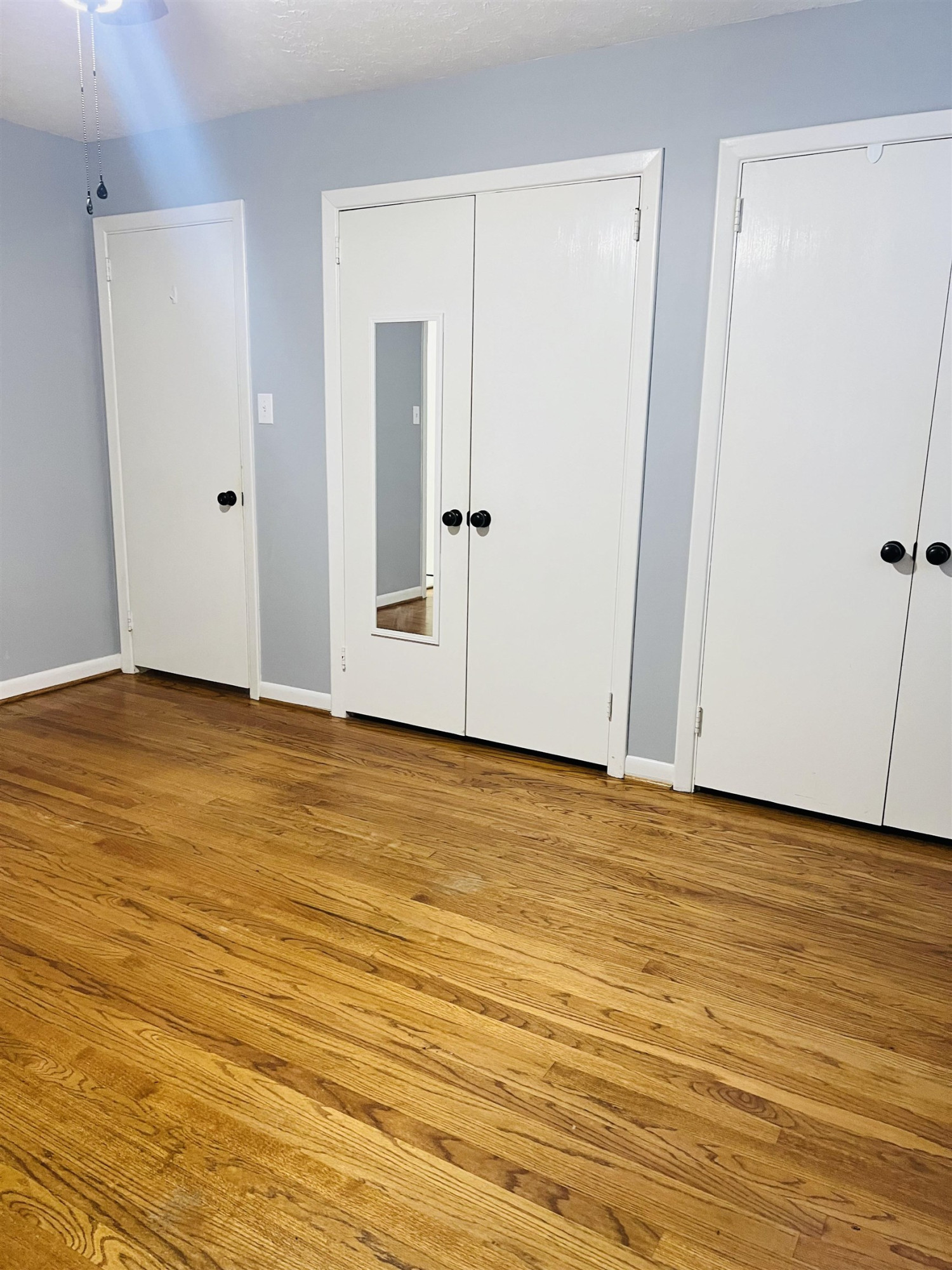 2419 Raeford Road Fayetteville, NC 28305 - Photo 11 of 36 a view of an empty room with wooden floor