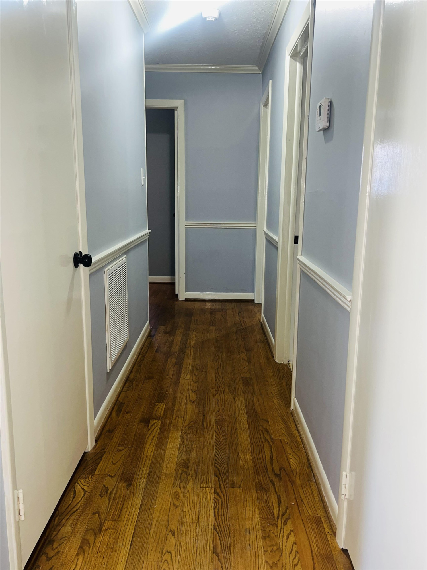 2419 Raeford Road Fayetteville, NC 28305 - Photo 15 of 36 a view of a hallway with wooden floor and entryway