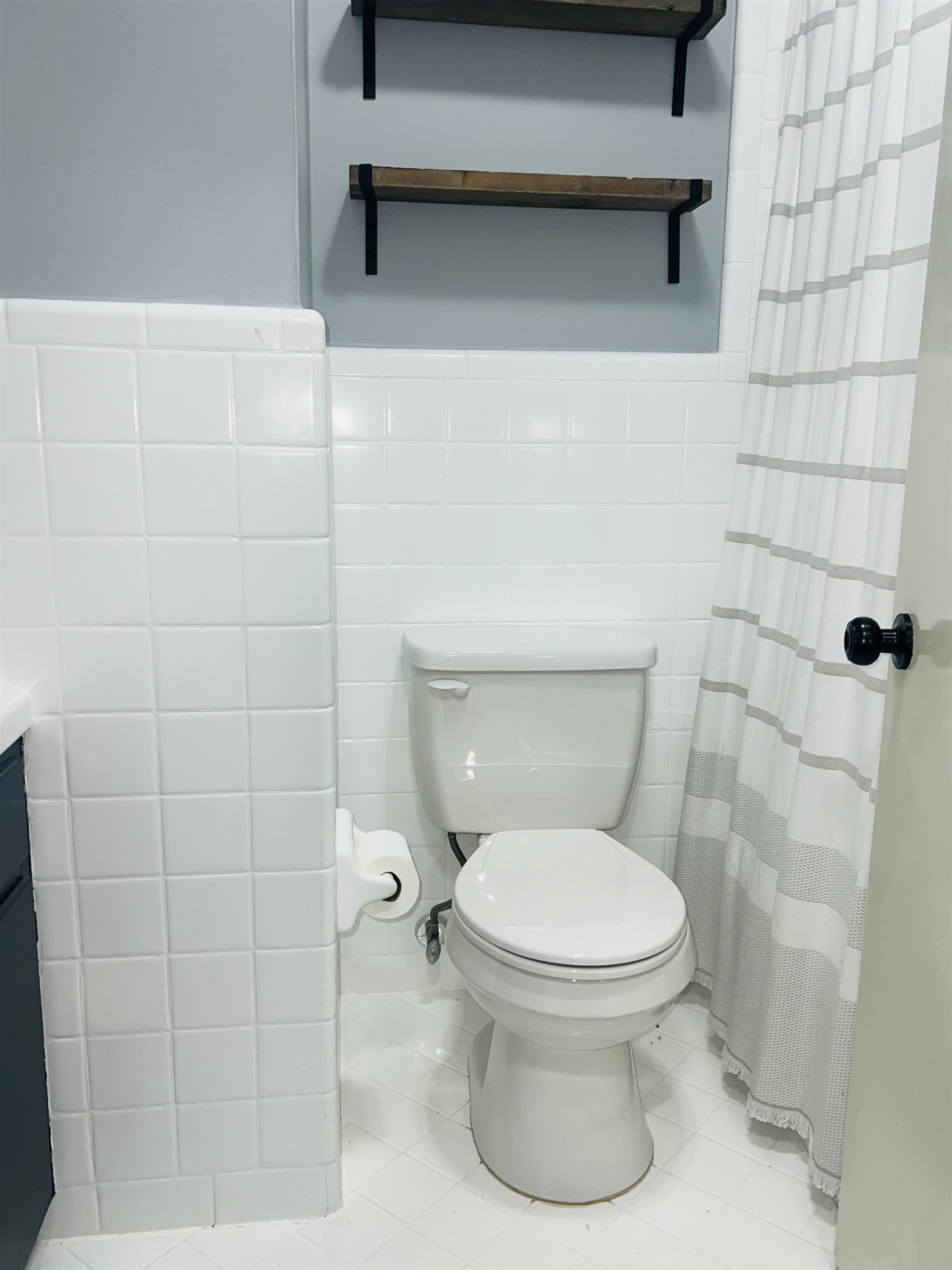 2419 Raeford Road Fayetteville, NC 28305 - Photo 17 of 36 a white toilet sitting next to a bathroom sink