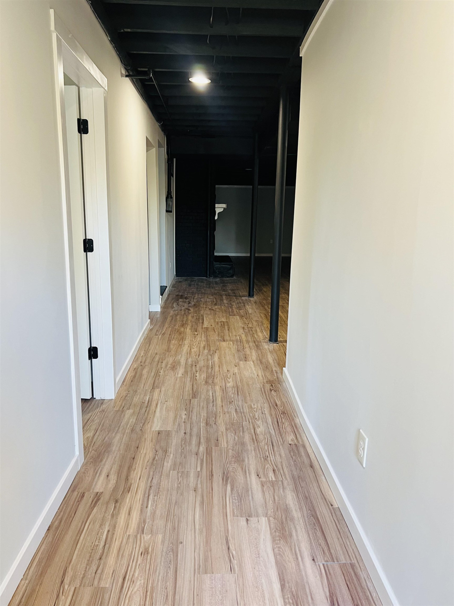 2419 Raeford Road Fayetteville, NC 28305 - Photo 19 of 36 a view of a room with wooden floor and a ceiling fan