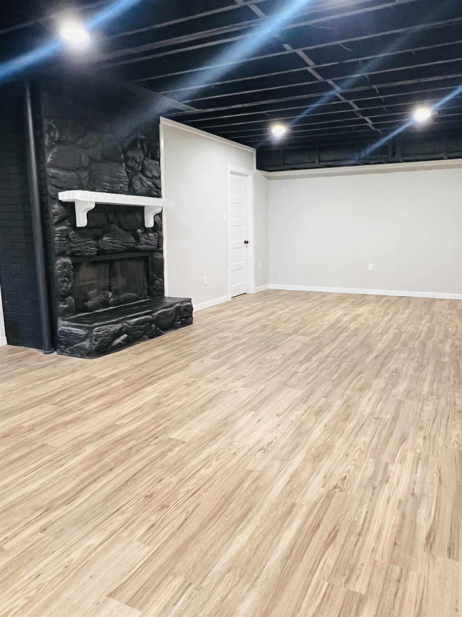 2419 Raeford Road Fayetteville, NC 28305 - Photo 32 of 36 a view of an empty room with wooden floor