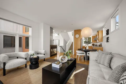 a view of a dining room with furniture and wooden floor