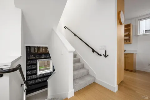 a view of a livingroom with stairs