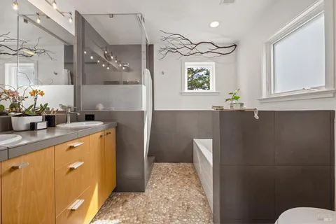 a bathroom with a shower and a window