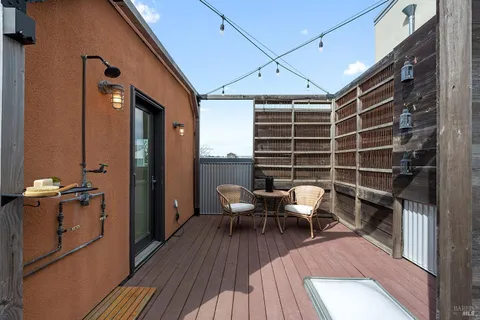 a bedroom with furniture and a potted plant