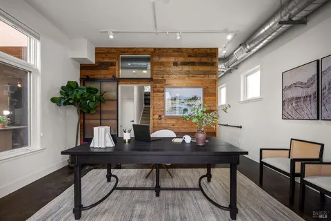 a view of a workspace with furniture