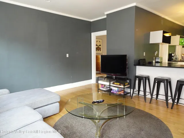 a kitchen with stainless steel appliances granite countertop a sink a stove top oven a counter space and cabinets