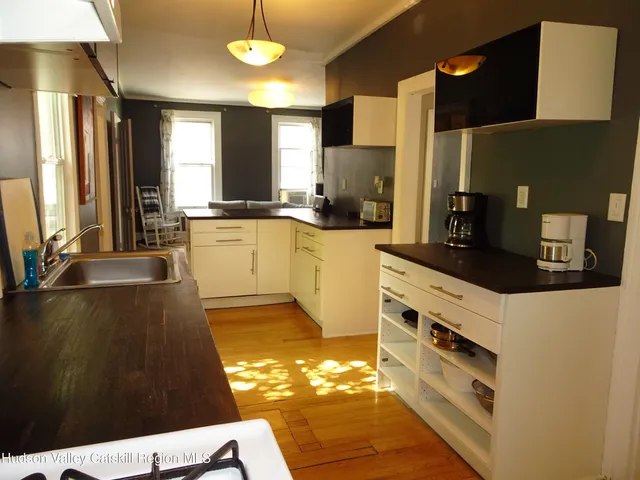 a room with furniture and wooden floor