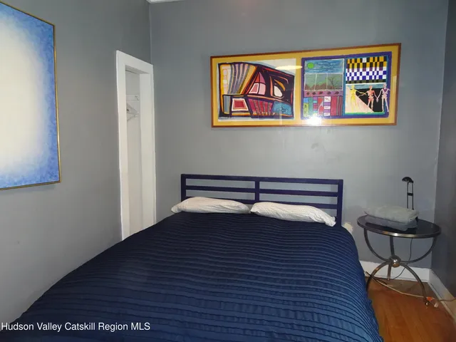 a view of a hardwood floor and staircase