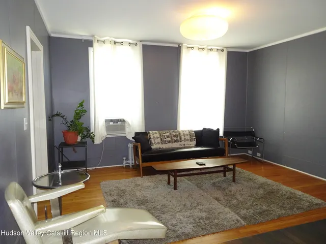 a living room with a couch and a table