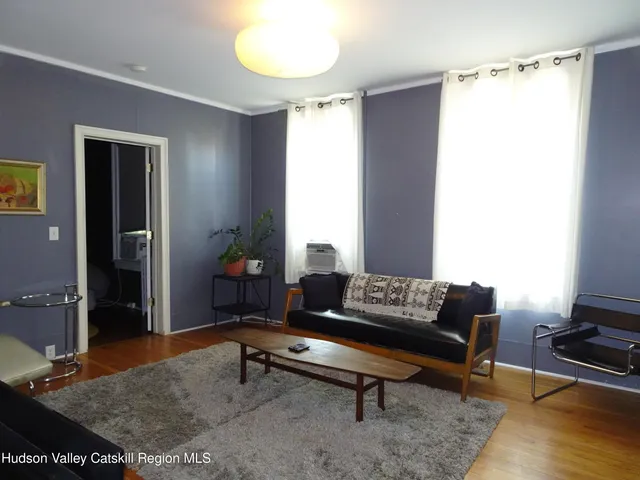 a living room with furniture and a table