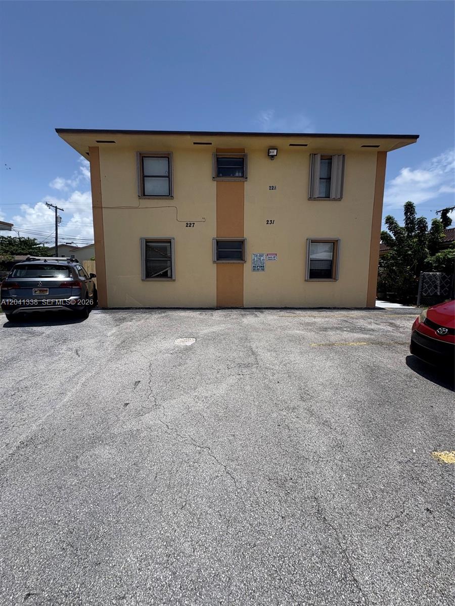 231 East 7th Street, Unit 202 Hialeah, FL 33010 - Photo 2 of 7 a view of a house with a yard
