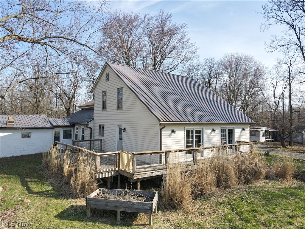 2081 Stroup Road Atwater, OH 44201 - Photo 4 of 48 Rear view of property featuring a wooden deck and a lawn