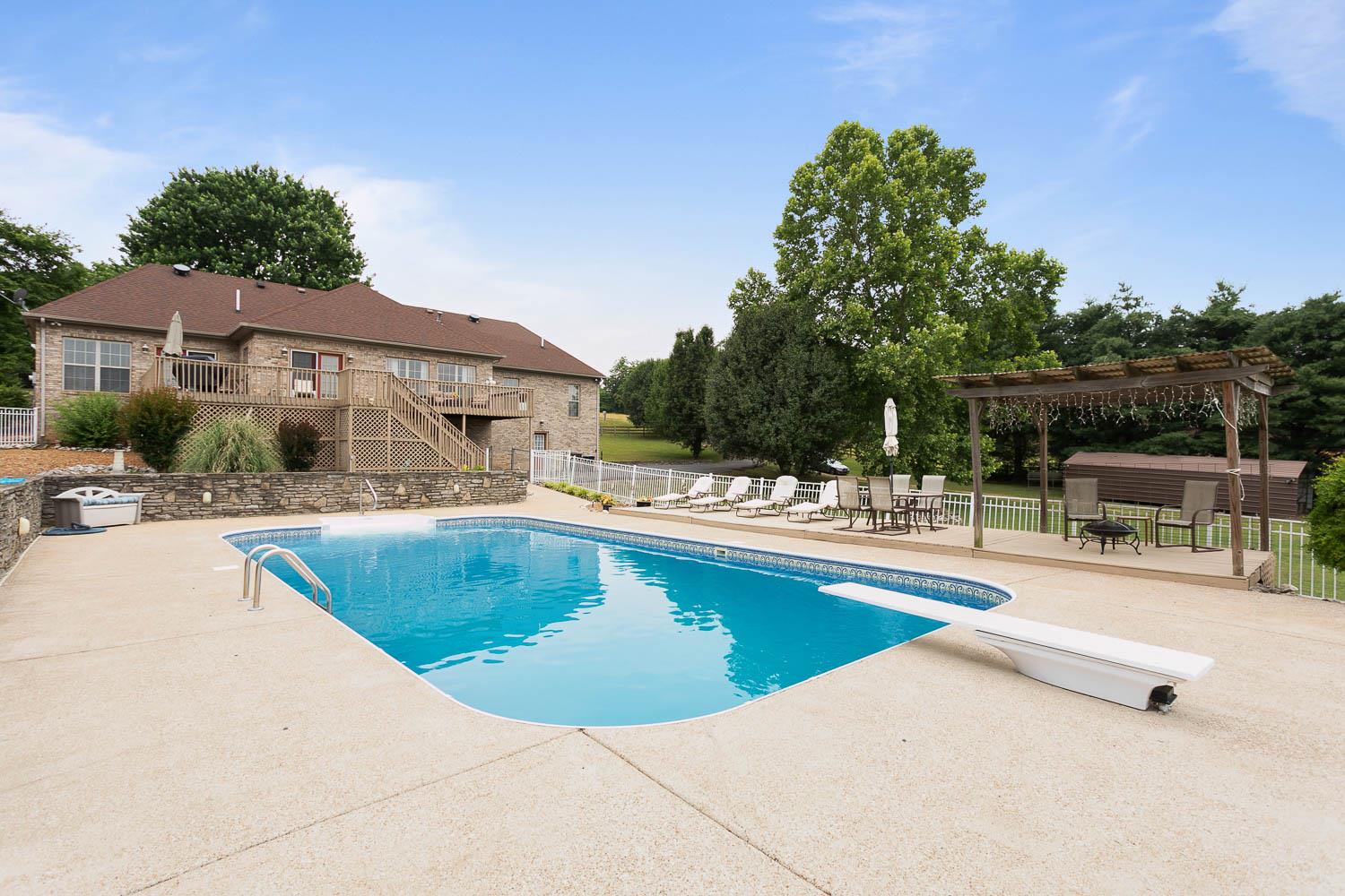 1018 Rip Steele Road Columbia, TN 38401 - Photo 17 of 28 a view of a swimming pool with lounge chair