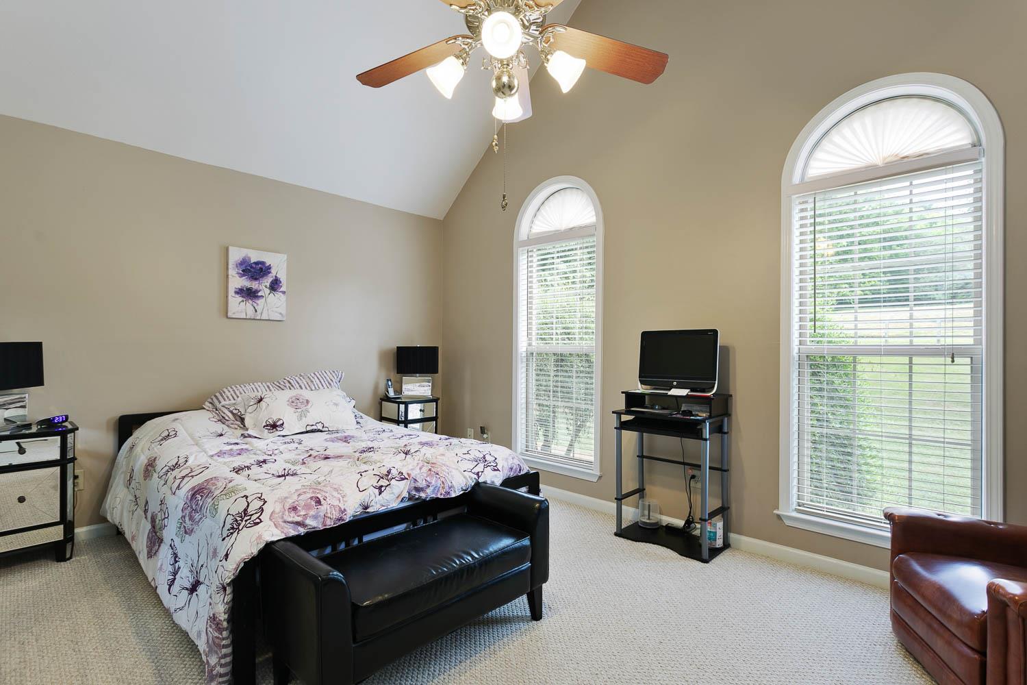 1018 Rip Steele Road Columbia, TN 38401 - Photo 23 of 28 a bedroom with a bed and a flat screen tv