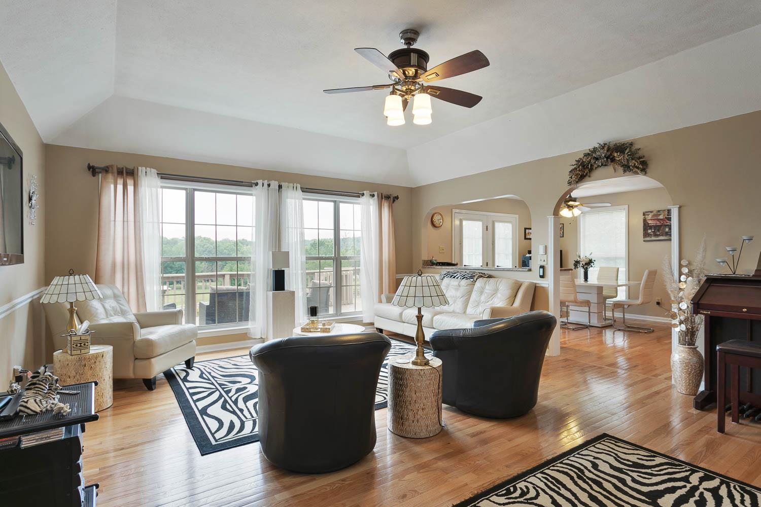 1018 Rip Steele Road Columbia, TN 38401 - Photo 8 of 28 a living room with furniture large windows and wooden floor