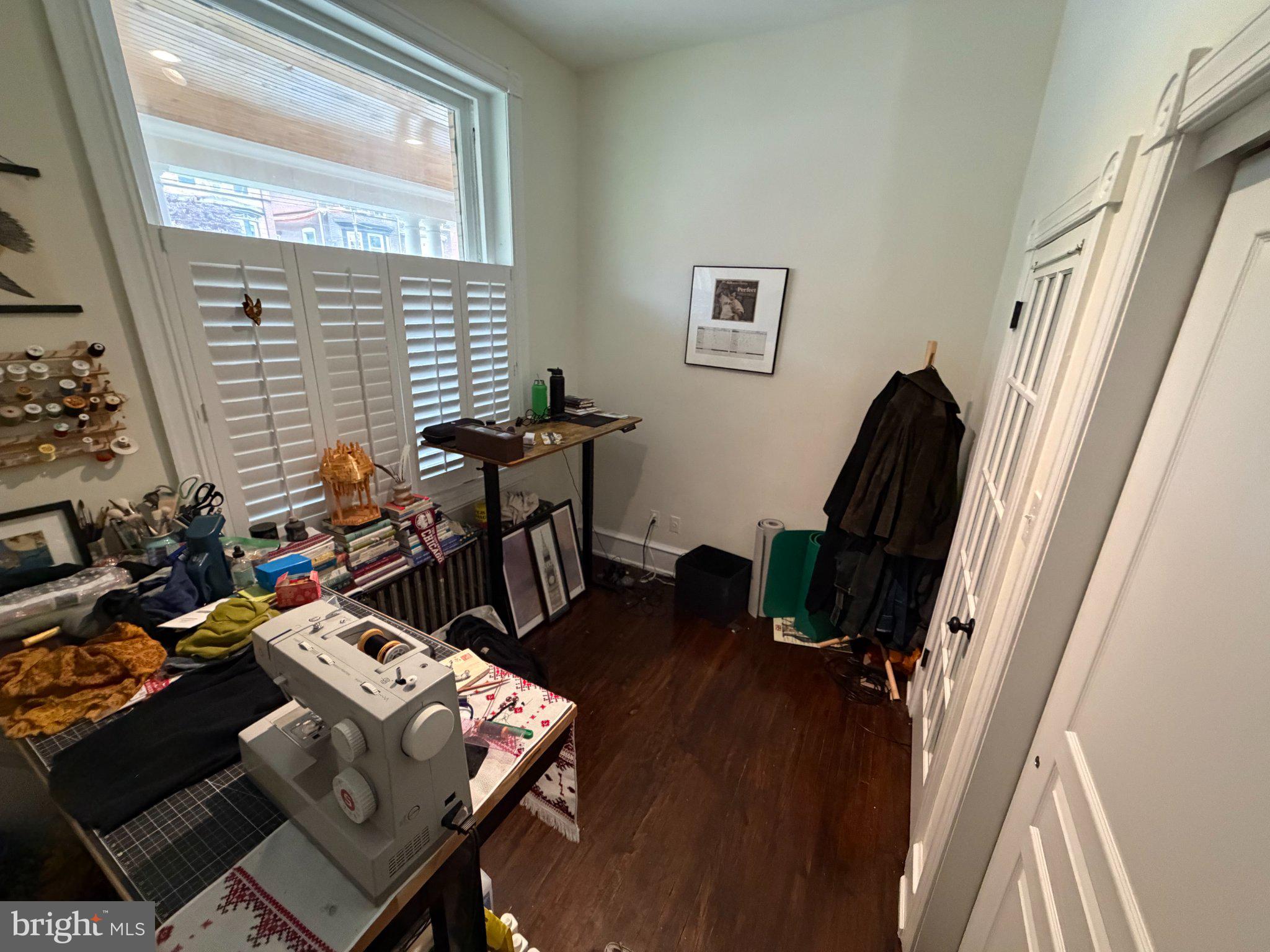 815 South 49th Street Philadelphia, PA 19143 - Photo 5 of 72 a view of a workspace with furniture and a window