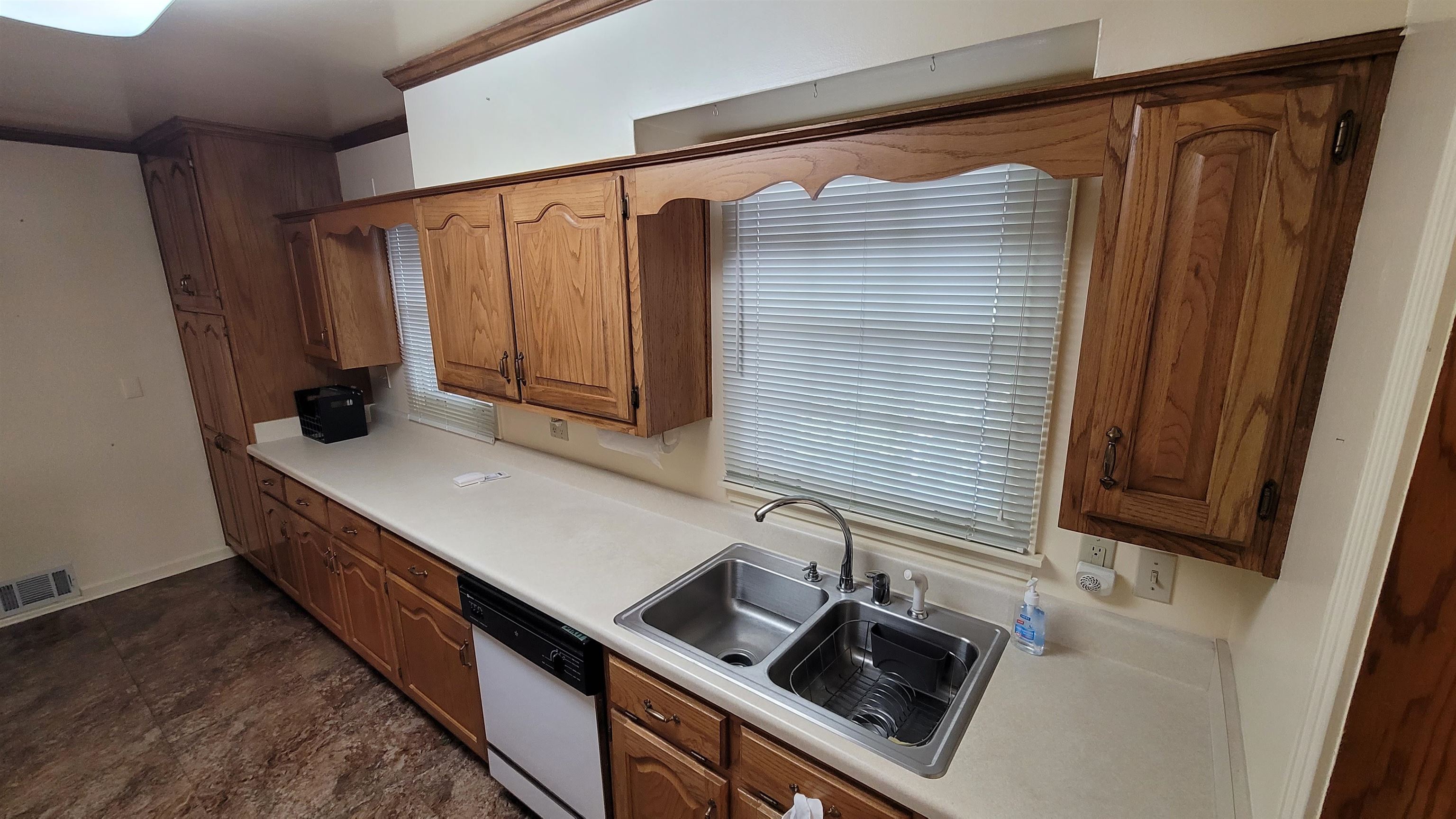 3745 Tchulahoma Road Memphis, TN 38118 - Photo 16 of 39 a kitchen with a sink and cabinets