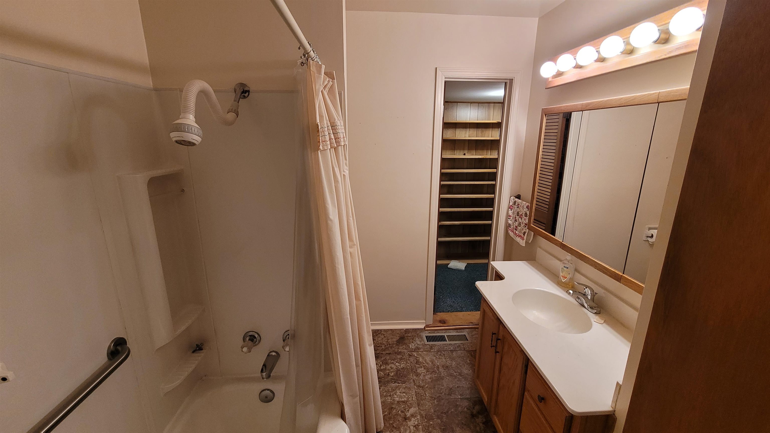 3745 Tchulahoma Road Memphis, TN 38118 - Photo 22 of 39 a bathroom with a sink a toilet and shower