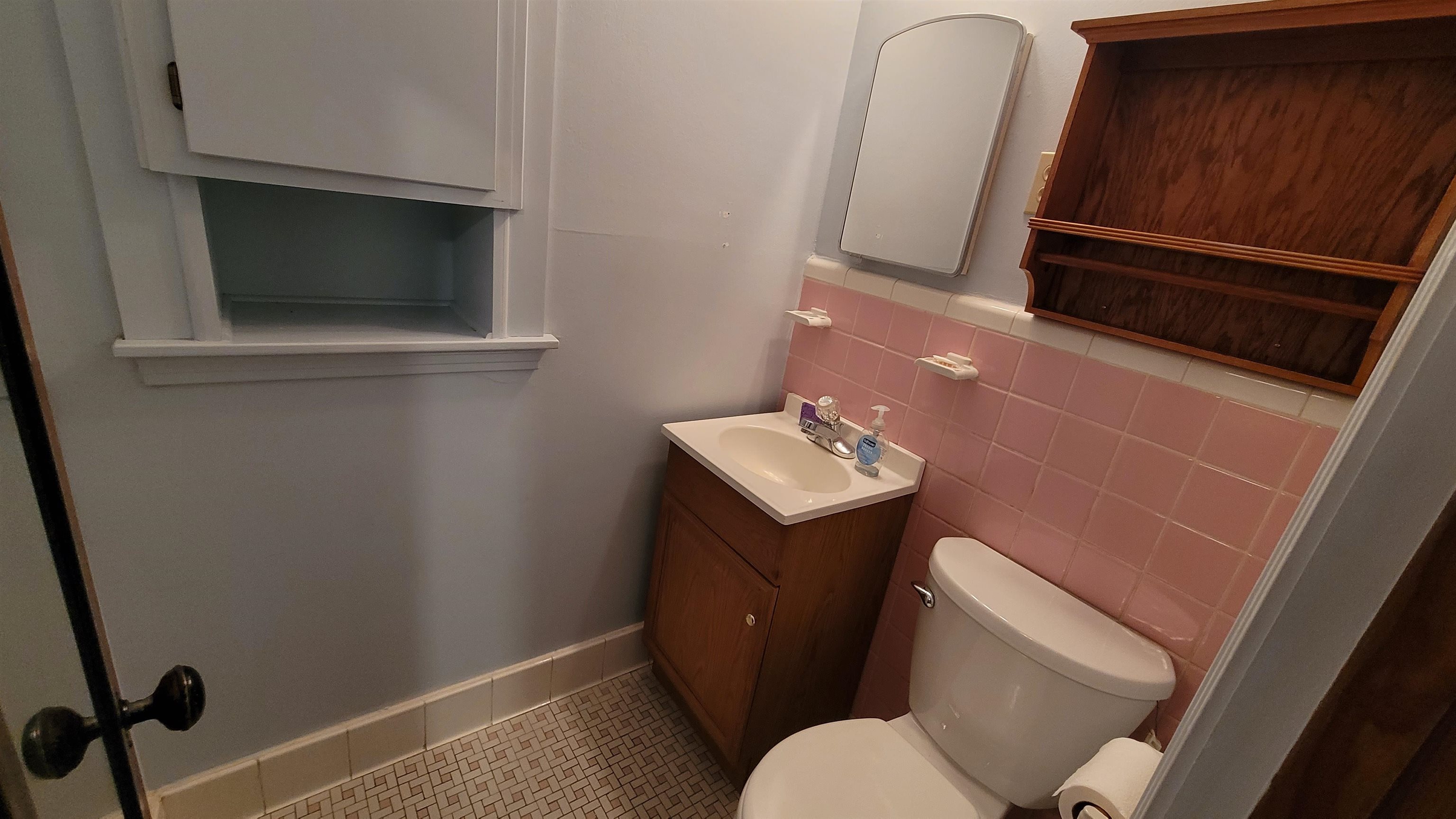 3745 Tchulahoma Road Memphis, TN 38118 - Photo 30 of 39 a bathroom with a sink a toilet and mirror