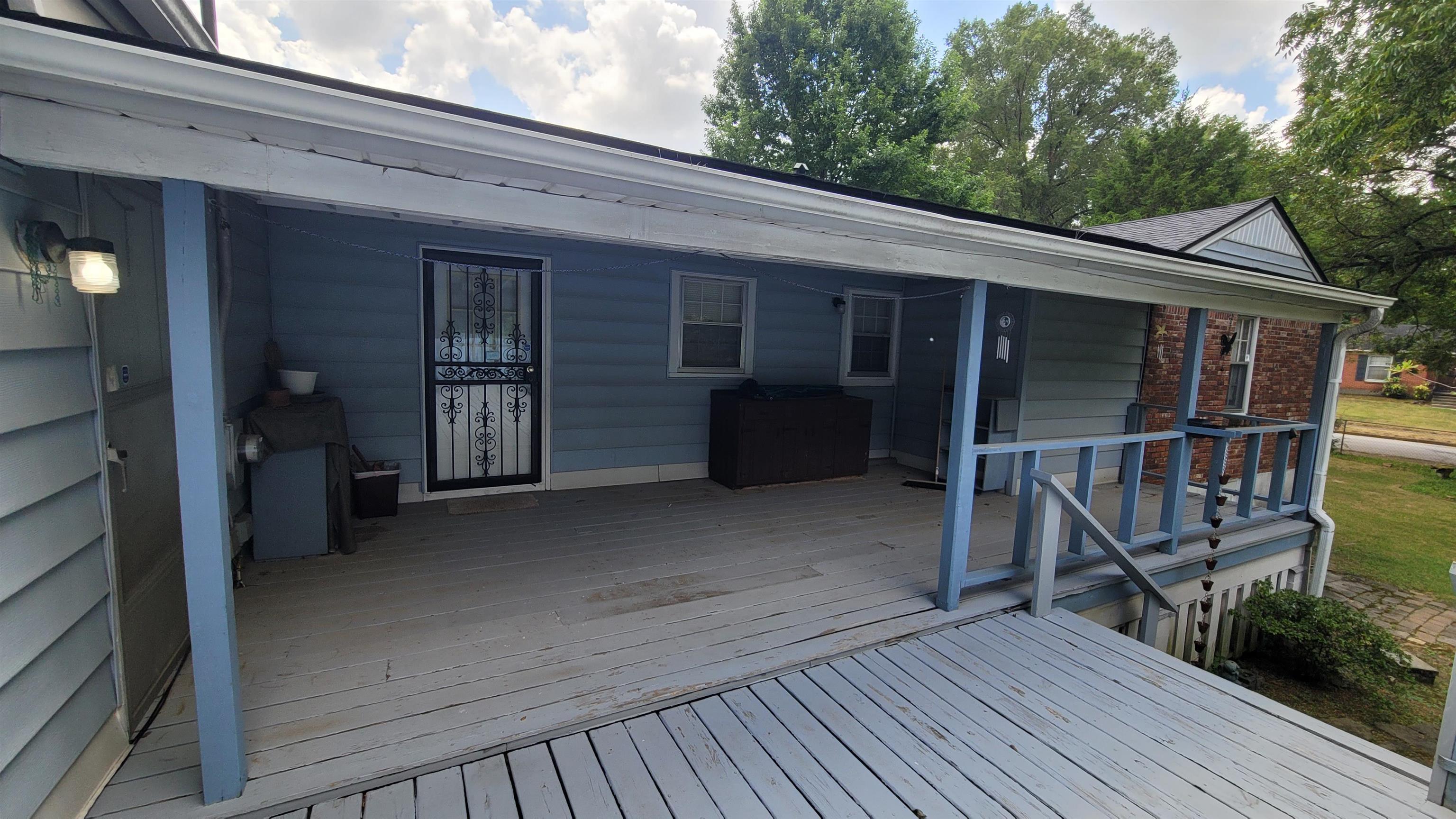 3745 Tchulahoma Road Memphis, TN 38118 - Photo 4 of 39 a view of backyard with deck and wooden floor