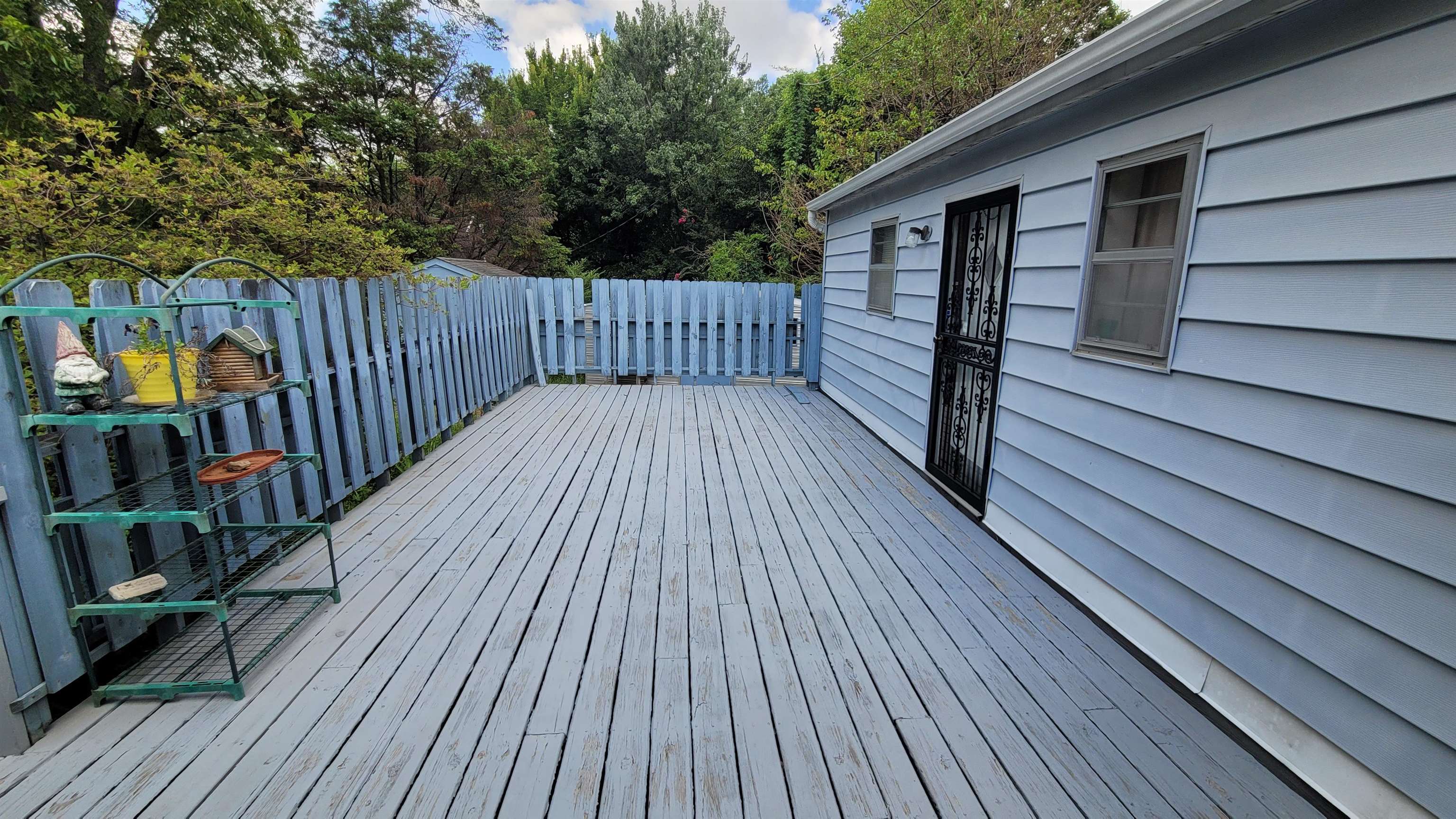 3745 Tchulahoma Road Memphis, TN 38118 - Photo 5 of 39 a view of deck with wooden floor and outdoor seating