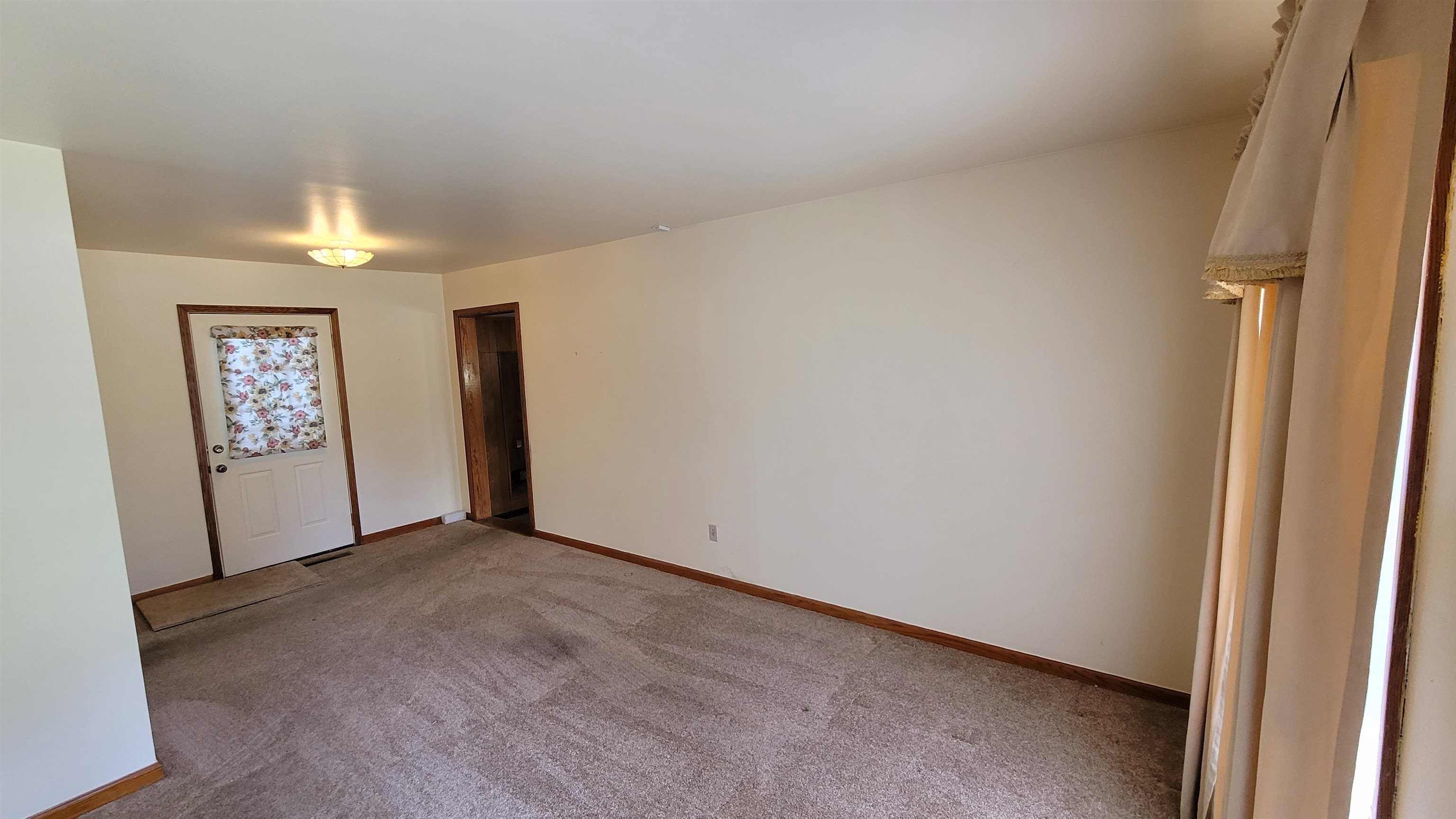 3745 Tchulahoma Road Memphis, TN 38118 - Photo 10 of 39 an empty room with windows and chandelier fan