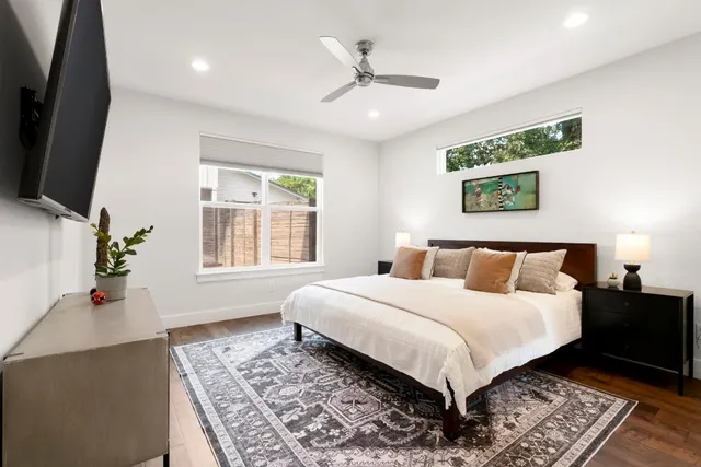 a kitchen with stainless steel appliances kitchen island granite countertop a refrigerator and a stove top oven