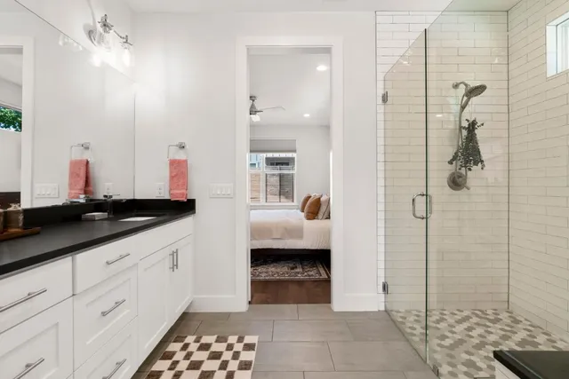 a large kitchen with a table and chairs