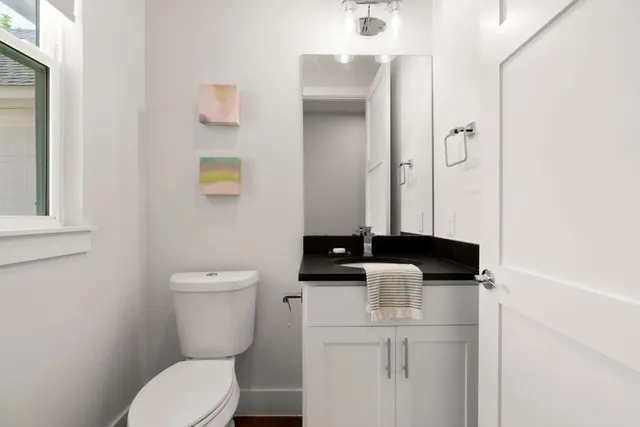 a bathroom with a double vanity sink a mirror and a shower