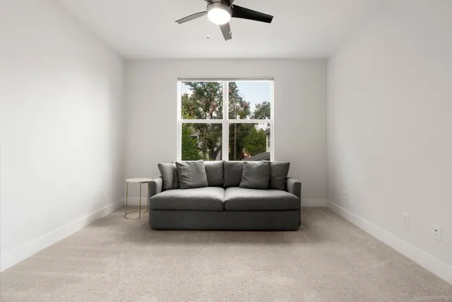 a view of a livingroom with furniture and window