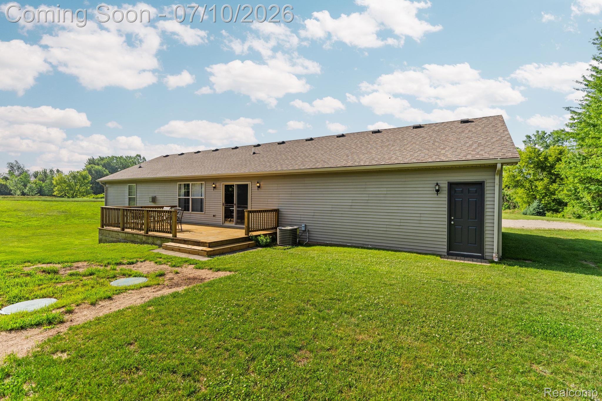 3144 North Nicholson Road Fowlerville, MI 48836 - Photo 29 of 70 Rear exterior featuring horizontal siding and a composite shingle roof