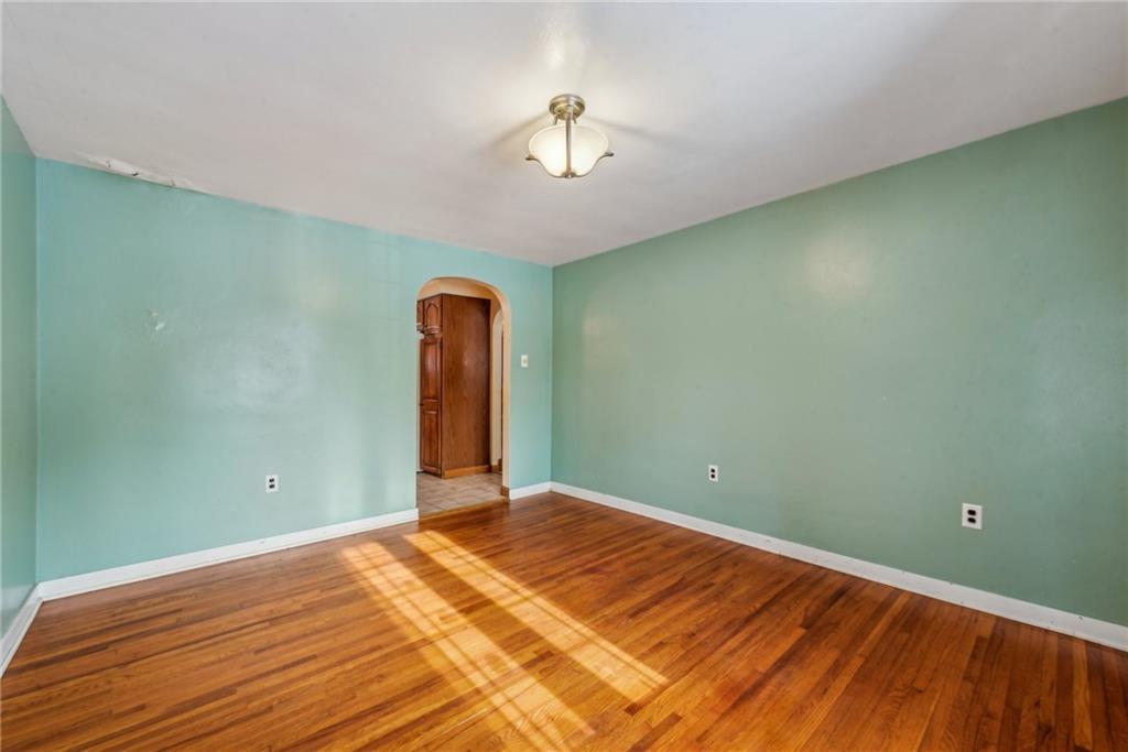 711 Pleasant Valley Road Connellsville, PA 15425 - Photo 14 of 46 a view of a room with wooden floor and a ceiling fan