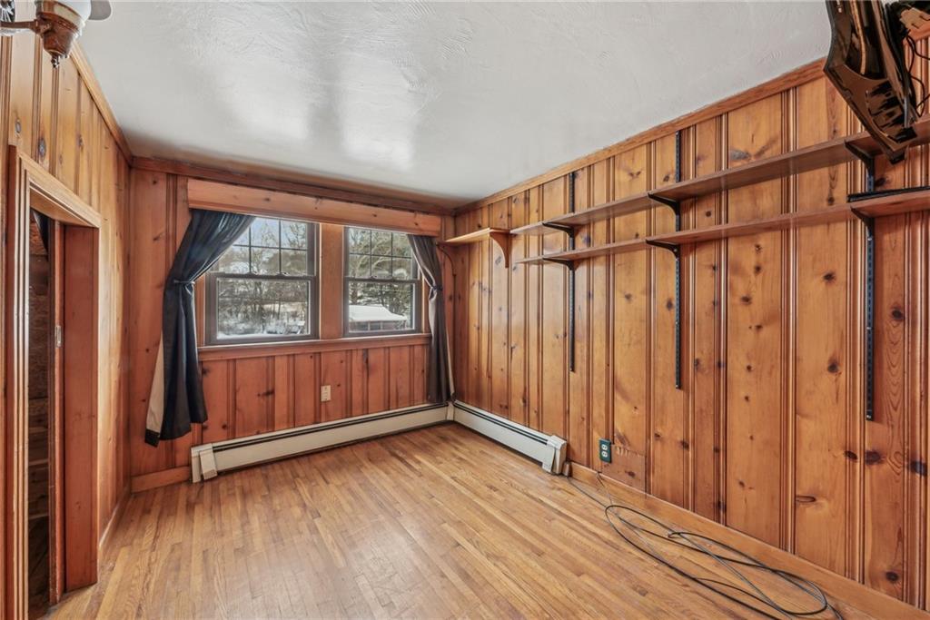 711 Pleasant Valley Road Connellsville, PA 15425 - Photo 21 of 46 a view of an empty room with wooden floor and a window
