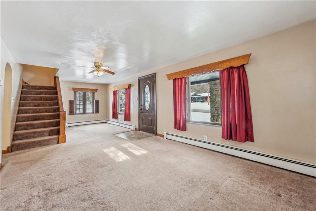 711 Pleasant Valley Road Connellsville, PA 15425 - Photo 6 of 46 a view of a room with stairs and a large window