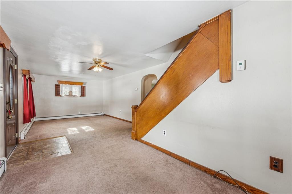 711 Pleasant Valley Road Connellsville, PA 15425 - Photo 7 of 46 a view of a hallway with paintings on the wall