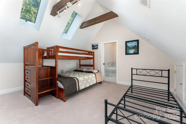 a bedroom with a bed and cabinets