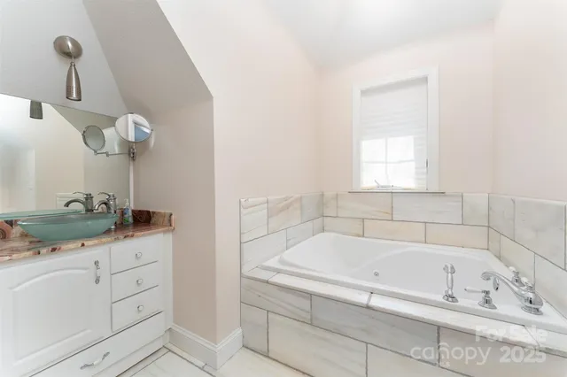 a bathroom with a bathtub and sink