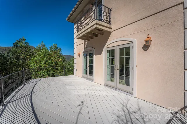 a view of a white house with a large window