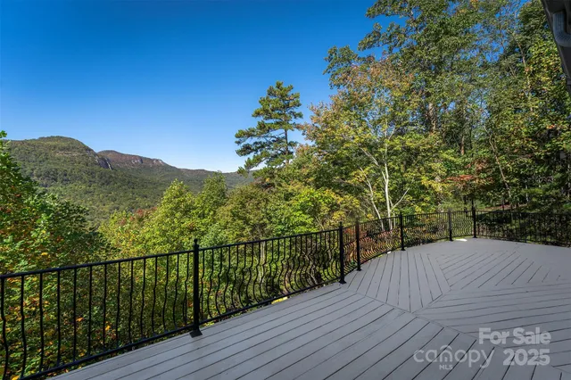 a view of a balcony with wooden fence