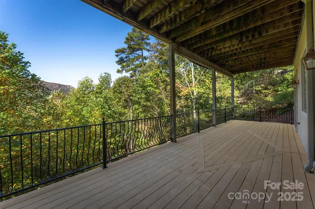 a balcony with trees in front of it