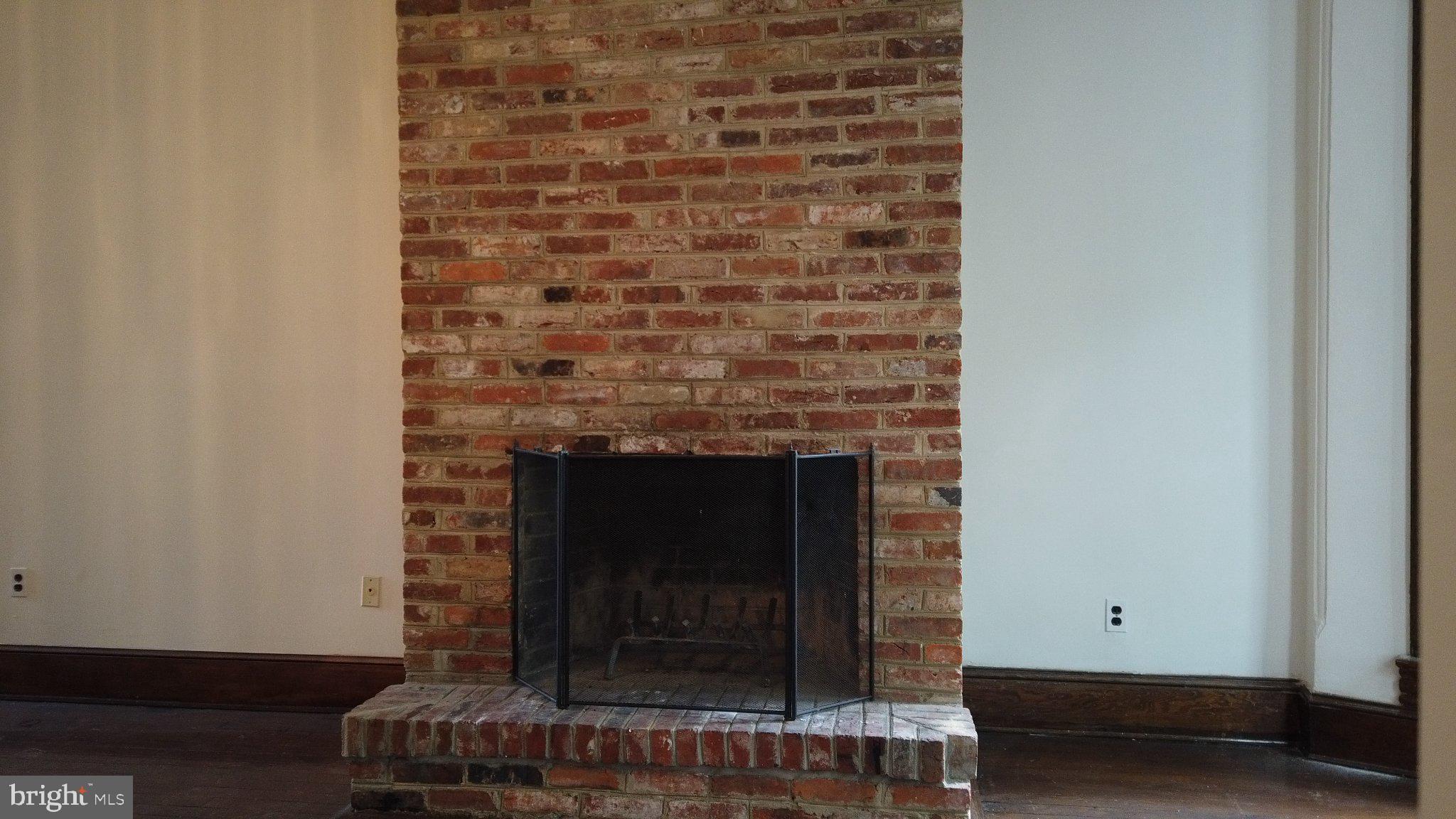 604 9th Street Northeast Washington, DC 20002 - Photo 26 of 28 Charming brick fireplace centerpiece.
