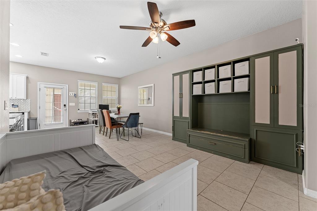3523 Clay Brick Road St. Cloud, FL 34773 - Photo 11 of 62 a living room with furniture a flat screen tv and a large window