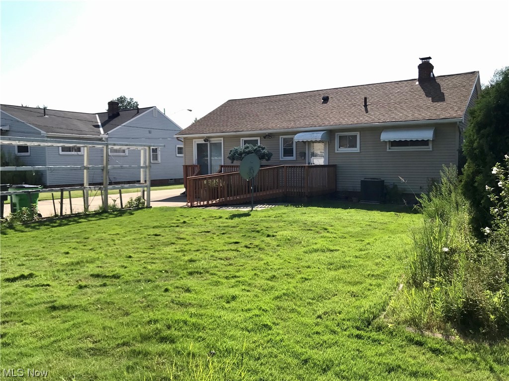 1767 Alcester Road Cleveland, OH 44124 - Photo 4 of 25 Back of property with a lawn and wooden deck